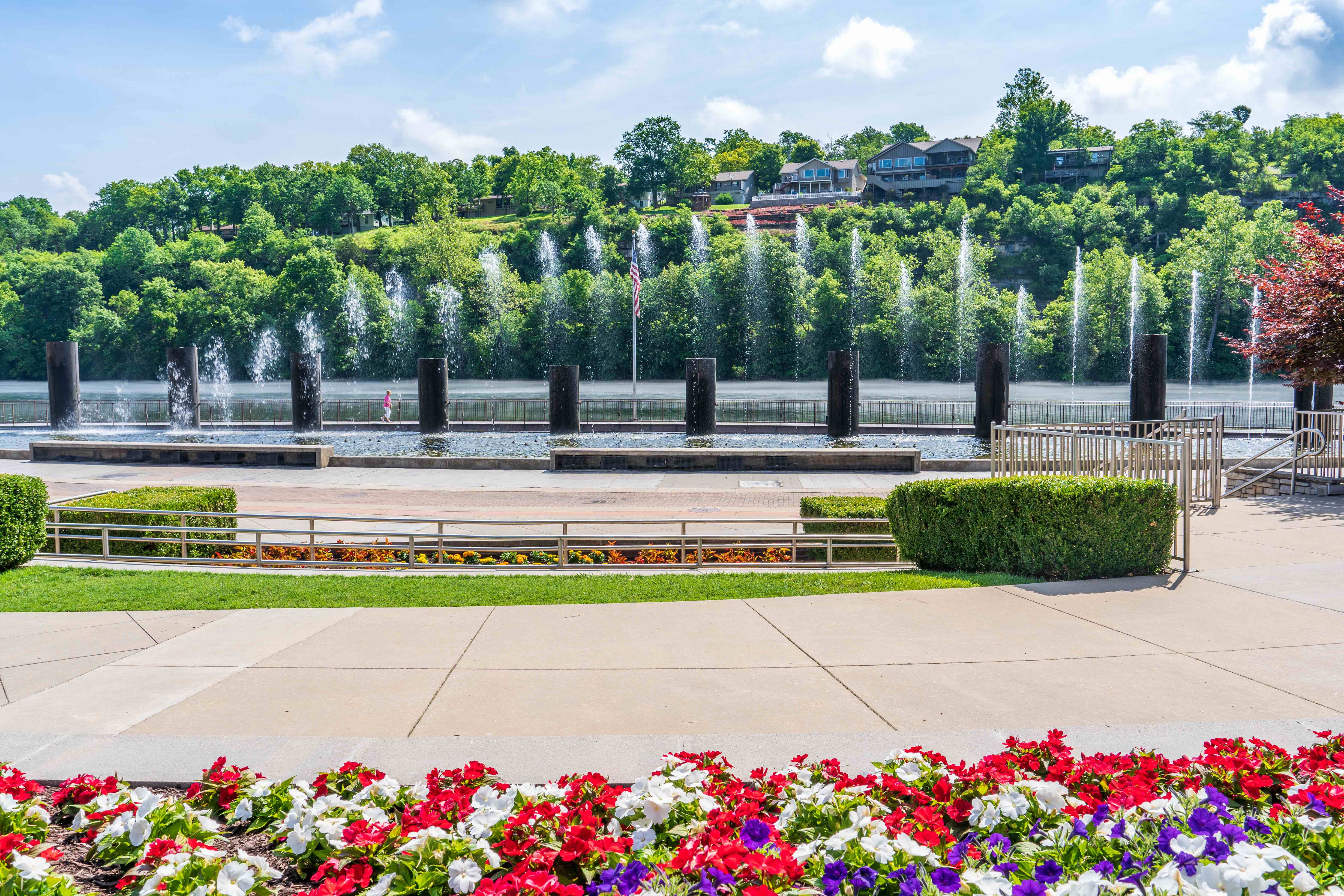 Fountain, surrounded by gardens, shooting out choreographed water at Branson Landing in Branson, Missouri.