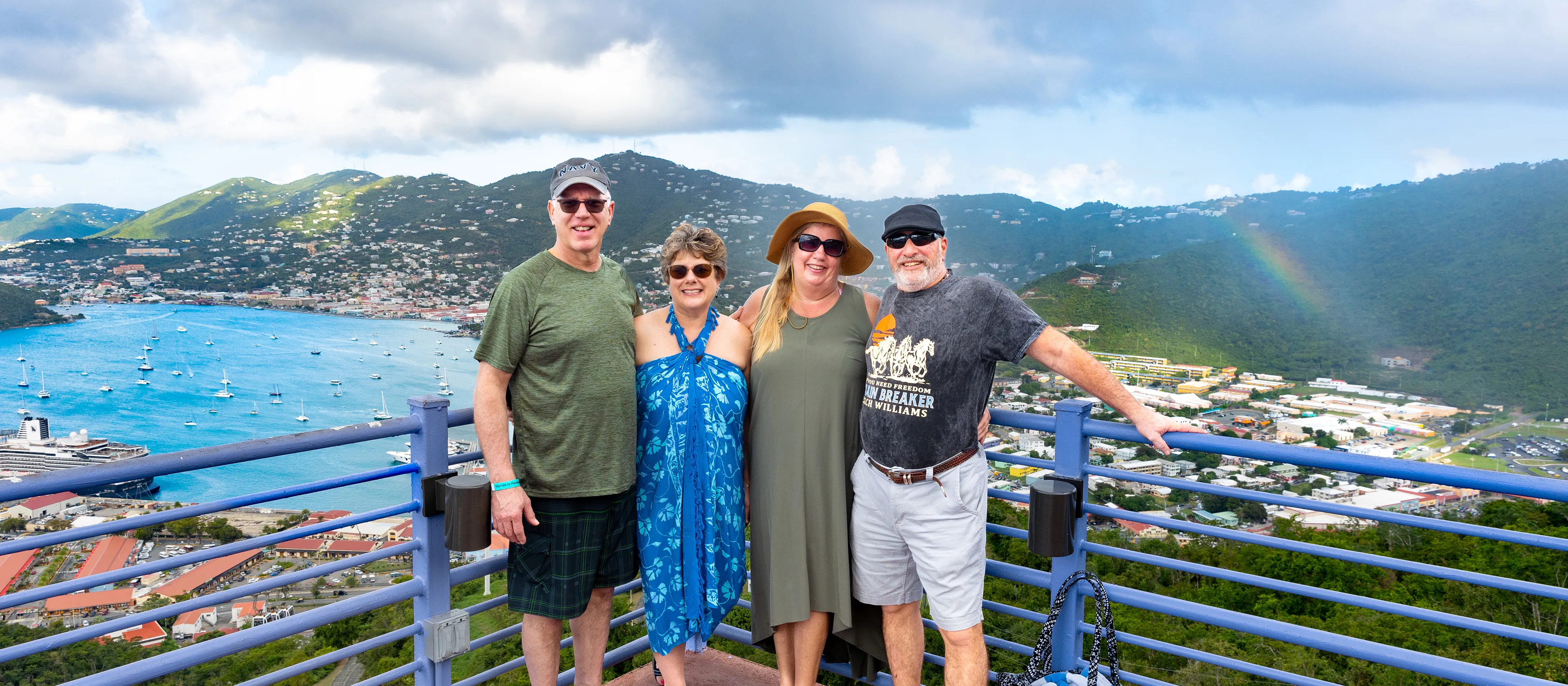 Travelers standing together overlooking St Thomas