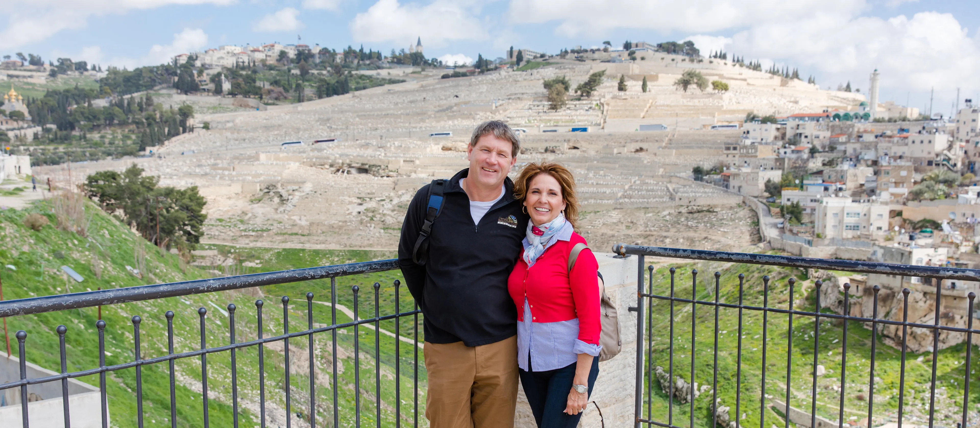 A couple standing together overlooking Israel