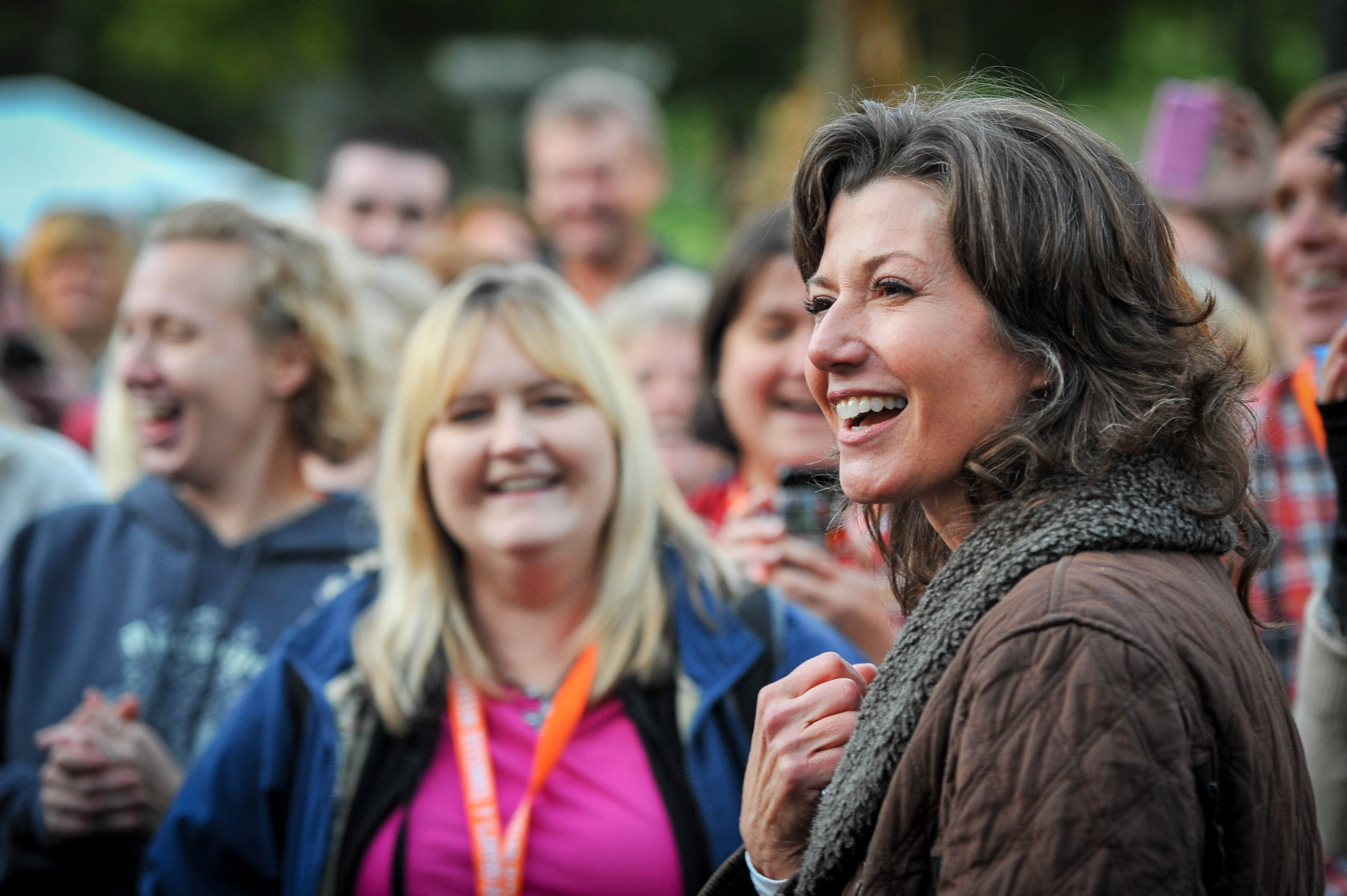 Amy Grant smiling with fans