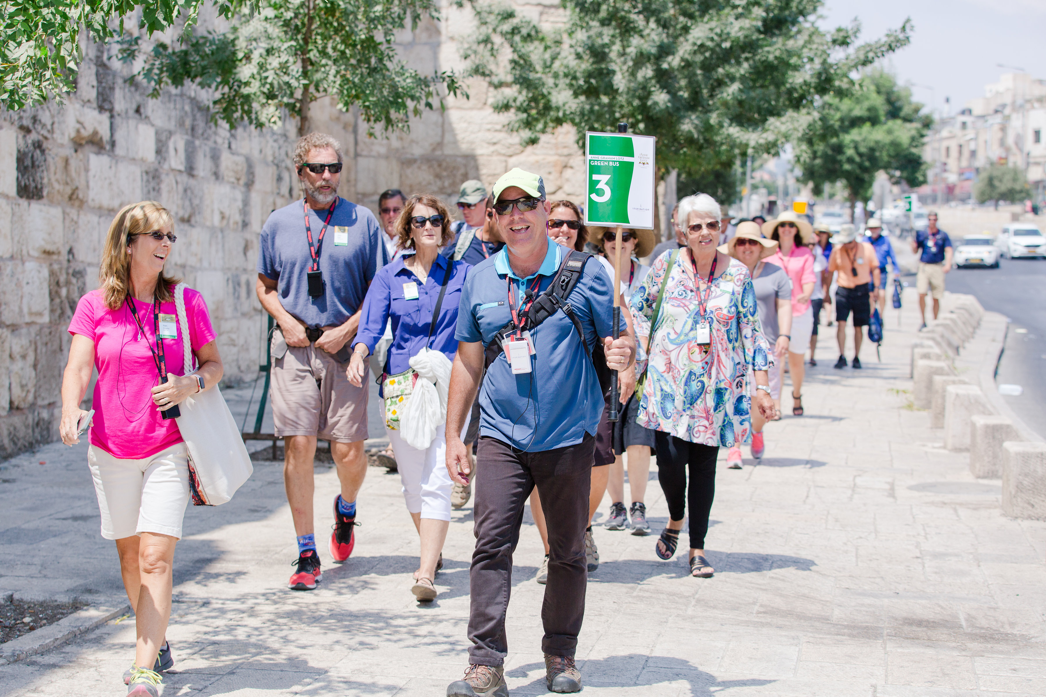 A group of Christian travelers walk the City Streets of Jerusalem