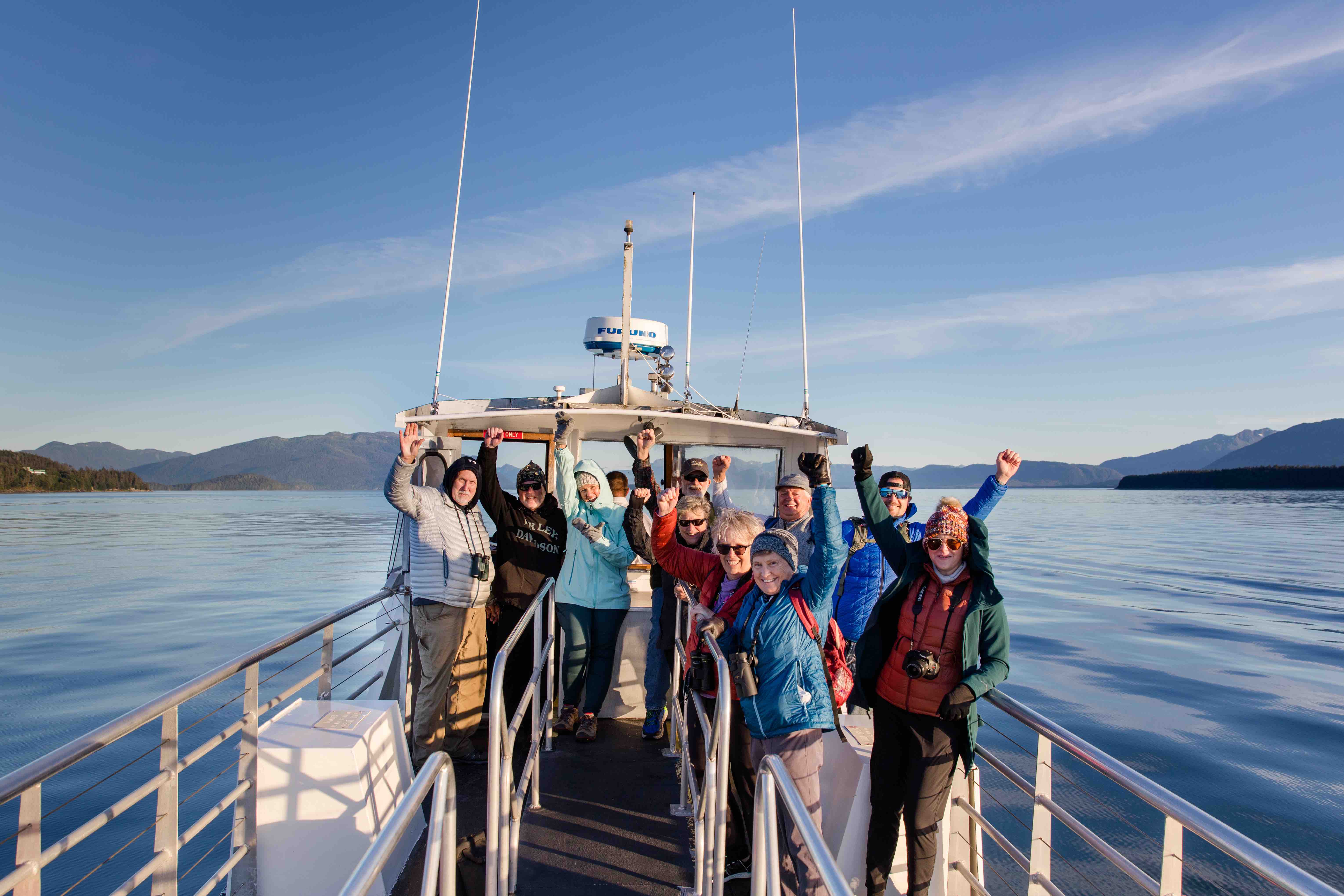 Group photo of whale-watchers in Juneau, Alaska