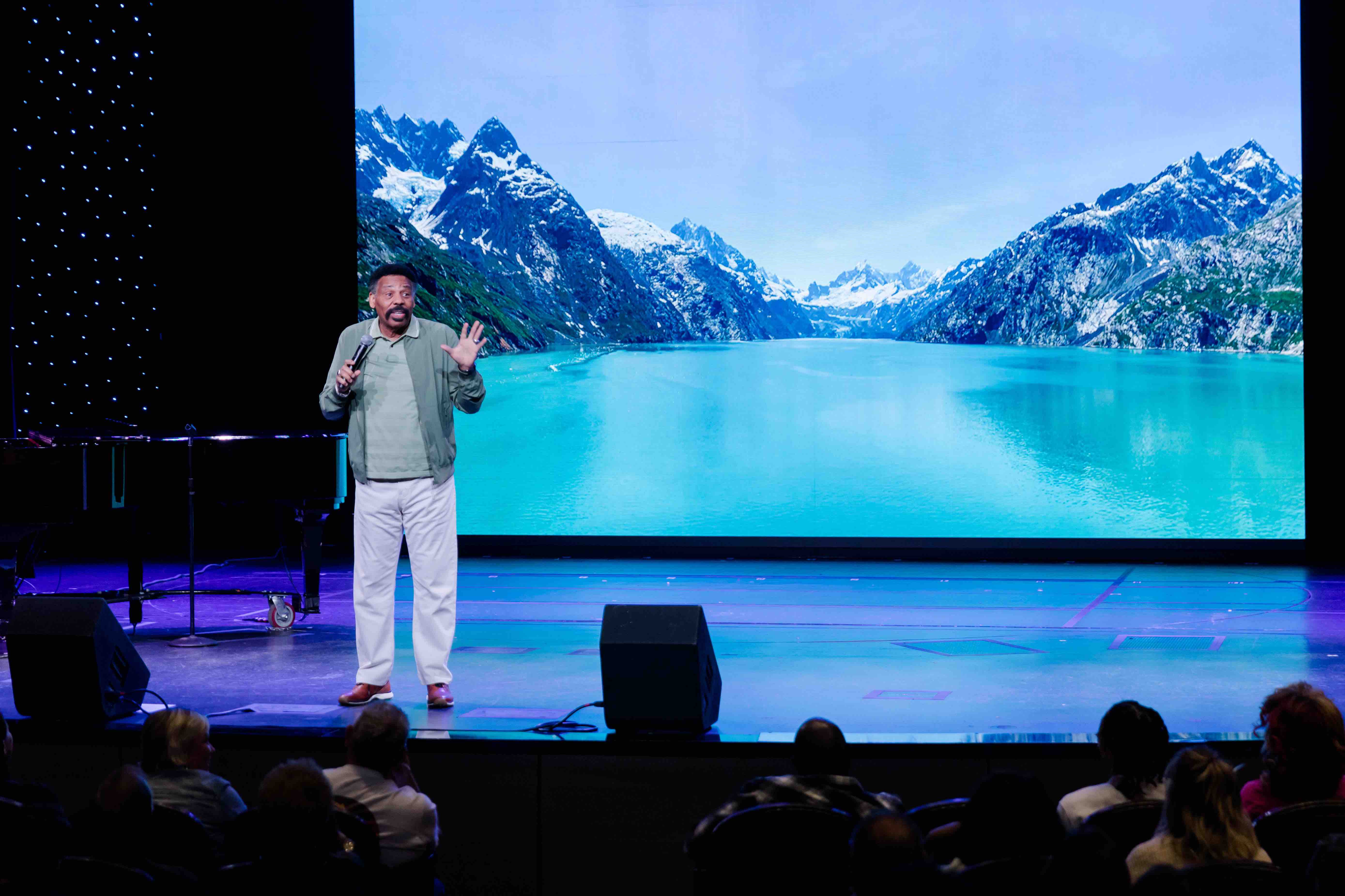 Pastor Tony Evans preaching on stage during an Alaska Cruise