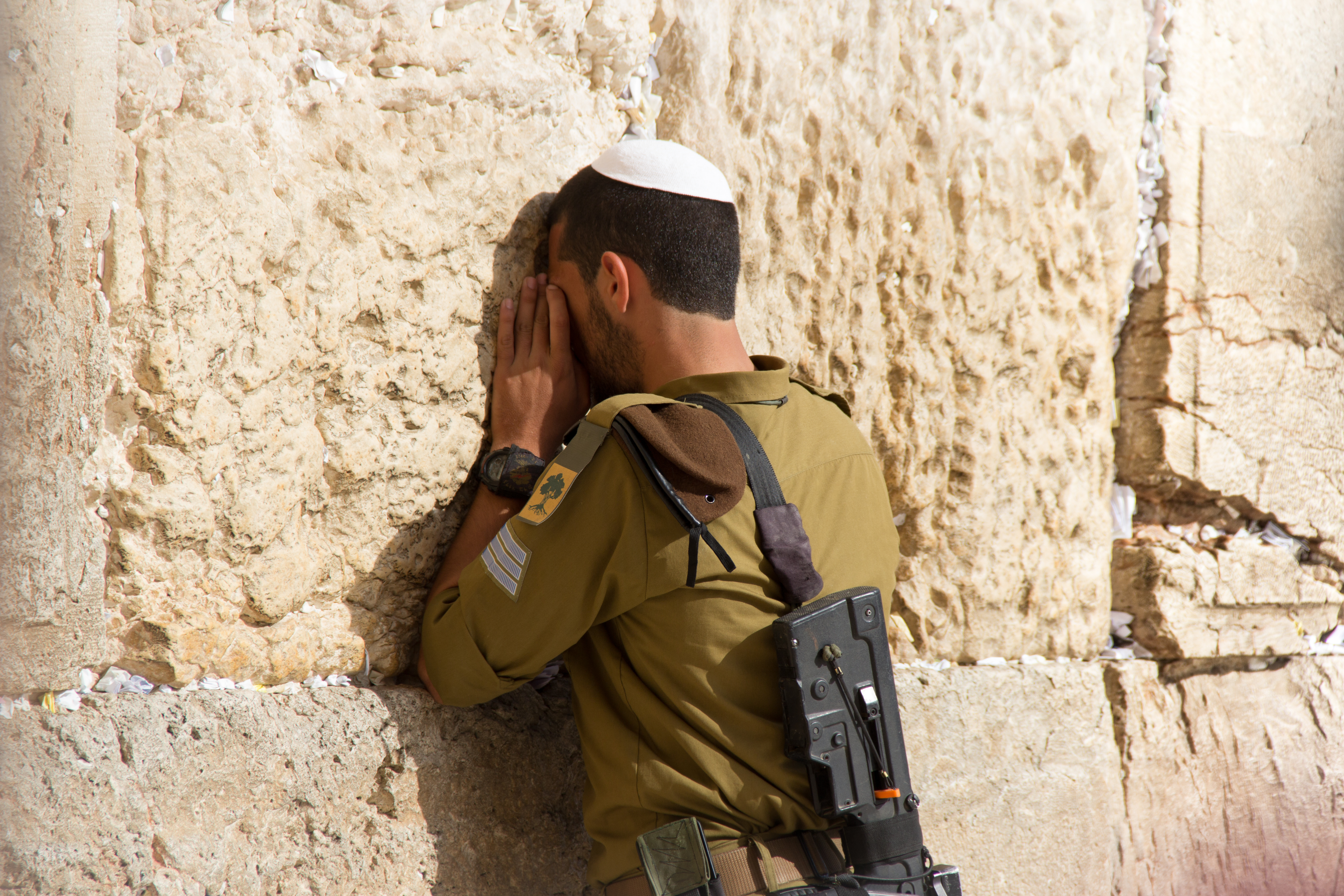 Israeli soldier prays at the Western Wall