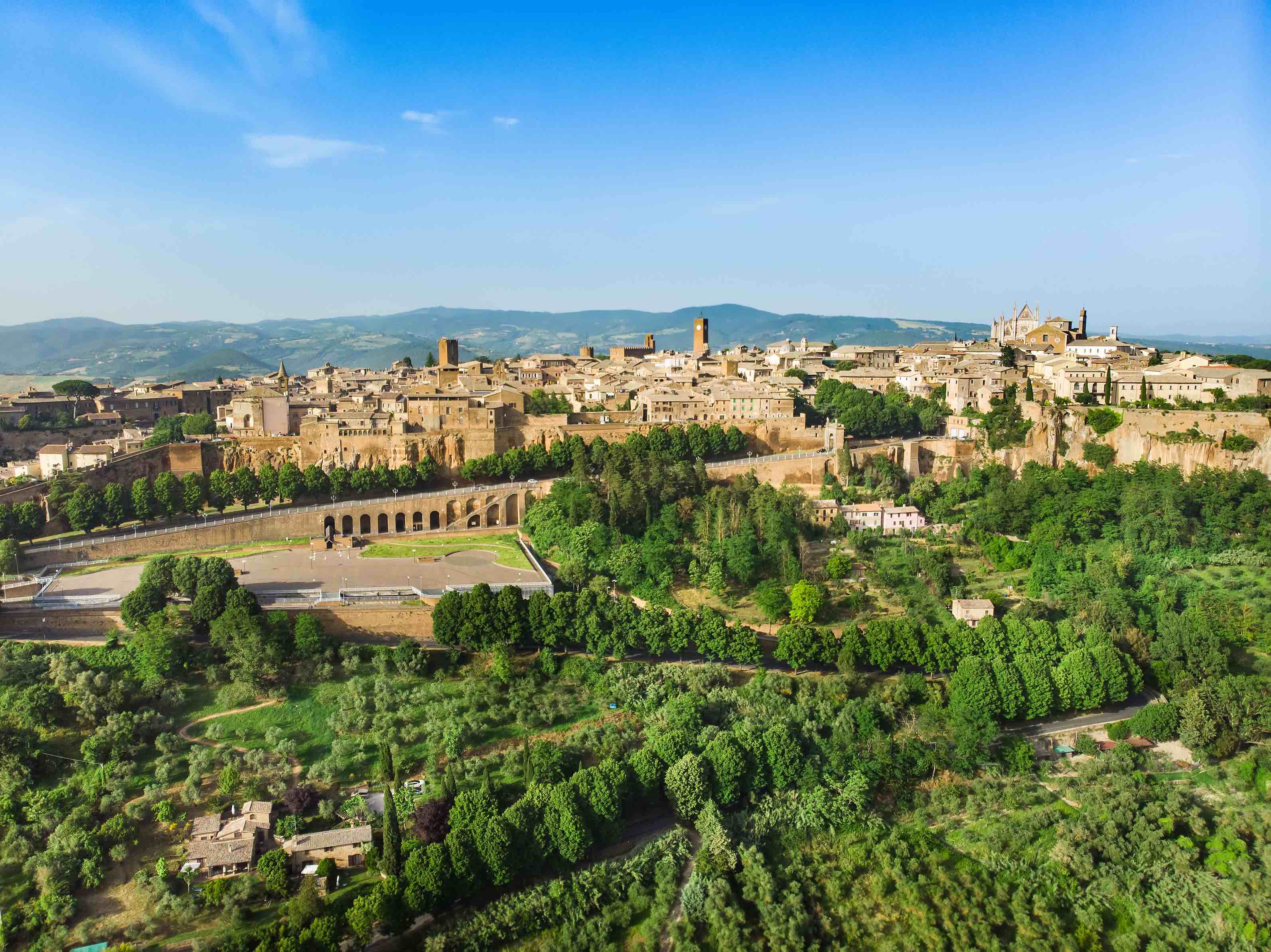Aerial view of the famed Orvieto, a medieval hill town, rising above the almost vertical faces of tuff cliffs