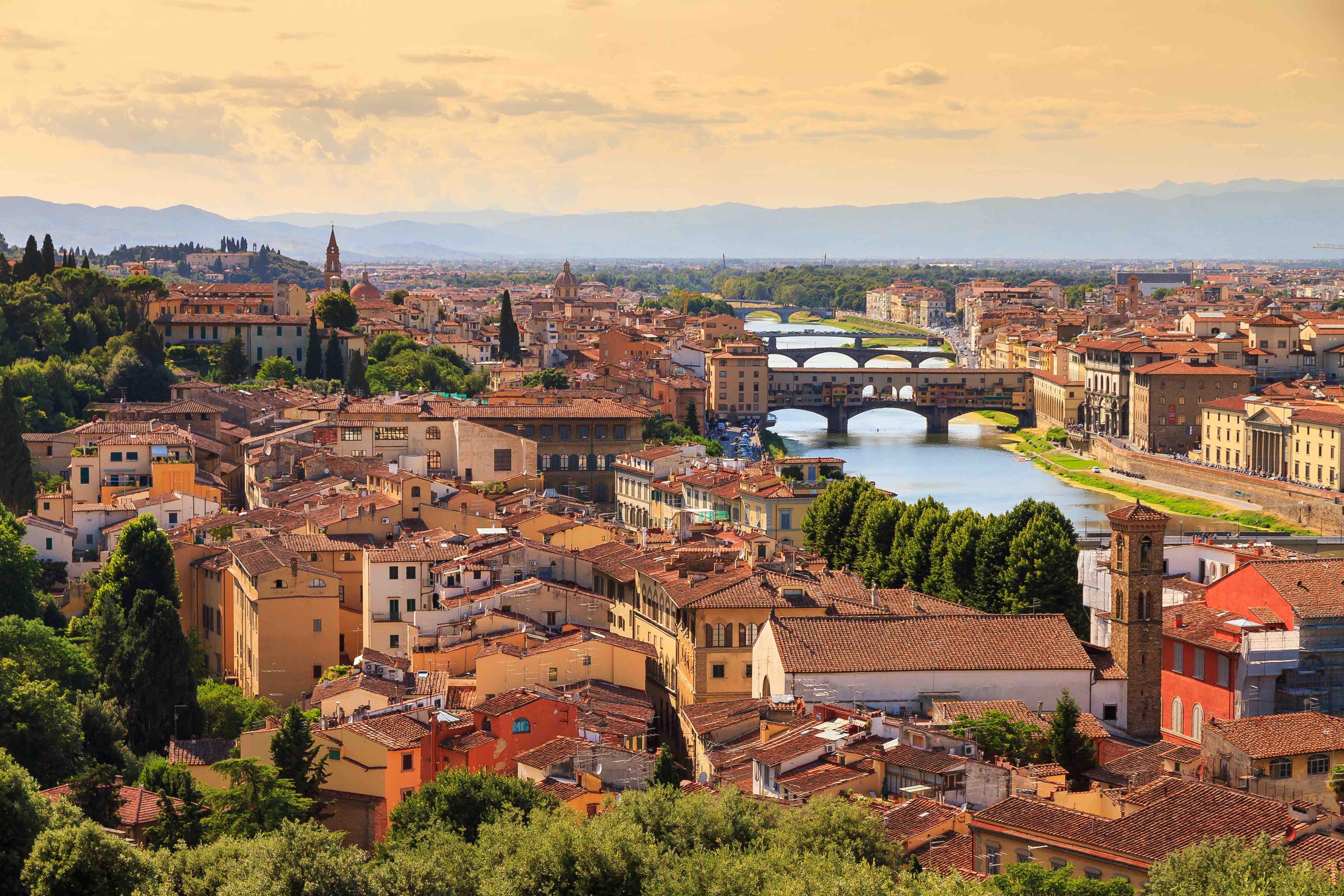 Beautiful cityscape skyline of Florence, Italy with the bridges over the river Arno in the distance